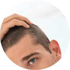 young-man-checking-hair-in-mirror-2021-08-26-15-34-43-utc_2x